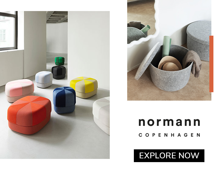 Colorful geometric ottomans and felt storage baskets by Normann Copenhagen in a minimalist interior setting.